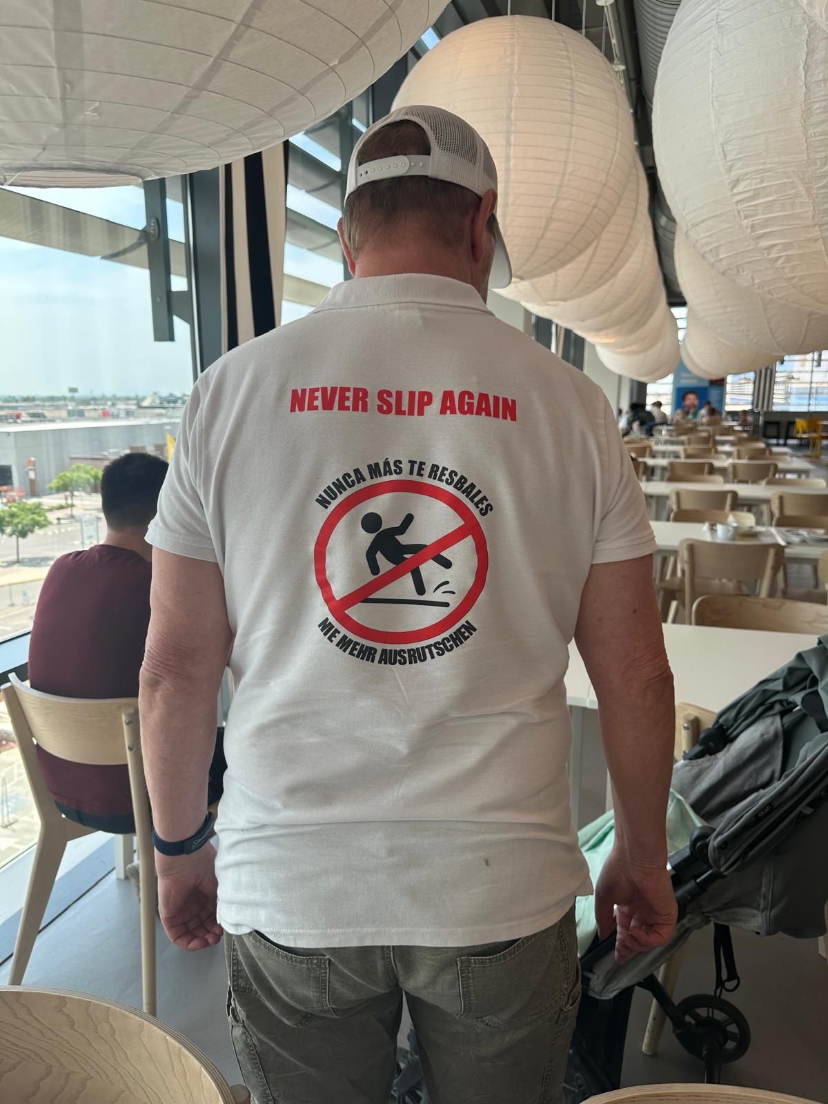 SWISS GriP team member wearing a Never Slip Again shirt